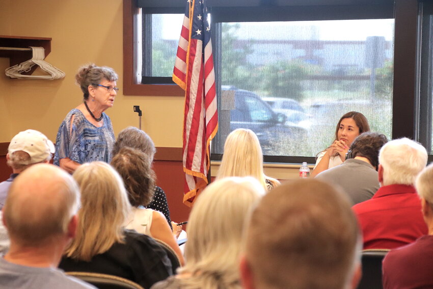 Jan Parker of Thornton urges representatives to repeal two provisions that limit how much Social Security beneficiaries can receive while Rep. Yadira Caraveo listens during a roundtable discussion Aug. 22 in Brighton.
